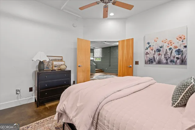 a bedroom with a bed and a dresser