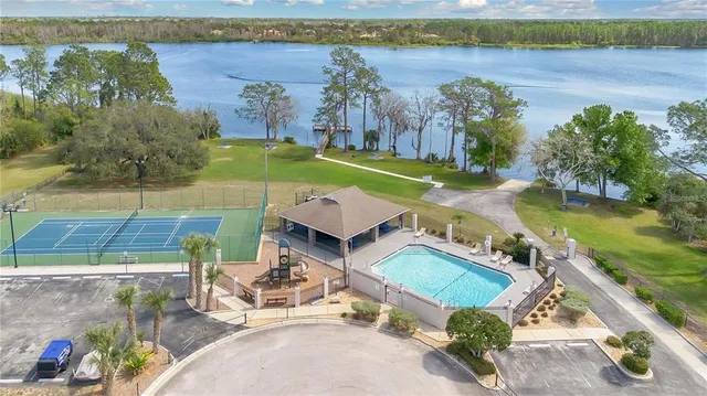 an aerial view of a house with a swimming pool