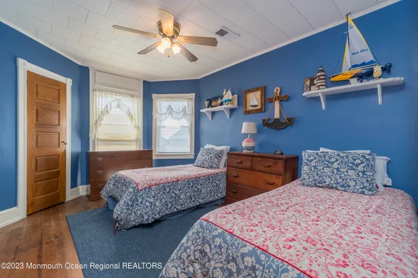 a bed room with a bed and a window