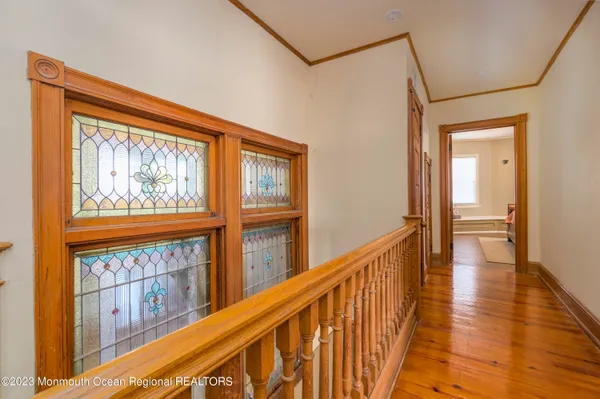 a kitchen with stainless steel appliances granite countertop a sink a refrigerator and a wooden cabinets
