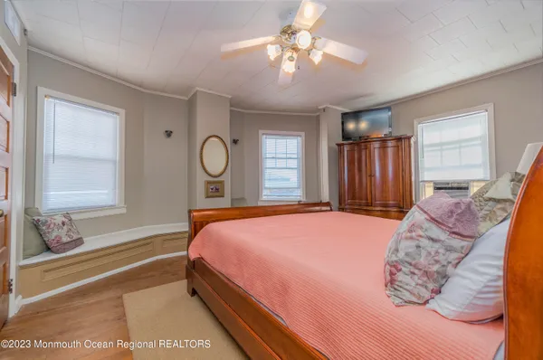 a kitchen with stainless steel appliances granite countertop wooden cabinets a stove a sink and a large window