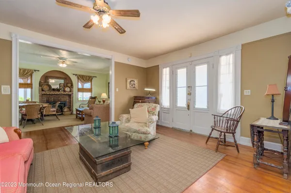 a bedroom with two beds and a chandelier