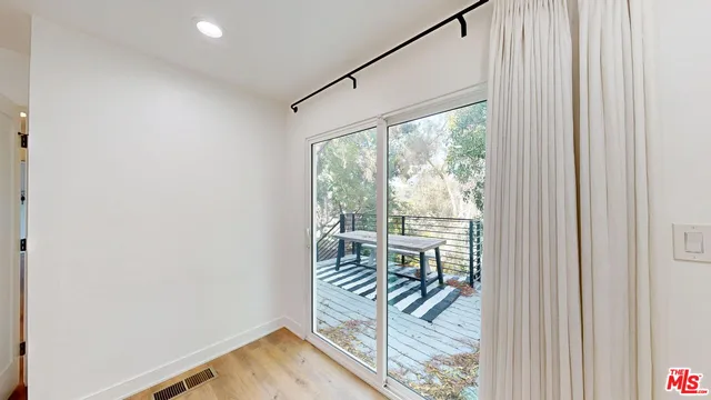 a view of a room with a large window