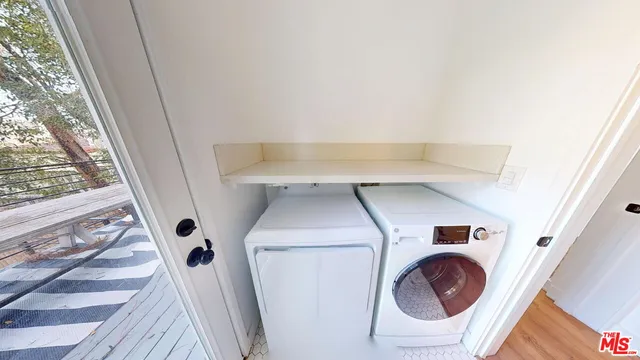 a utility room with dryer and washer