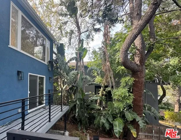 a view of a house with a tree