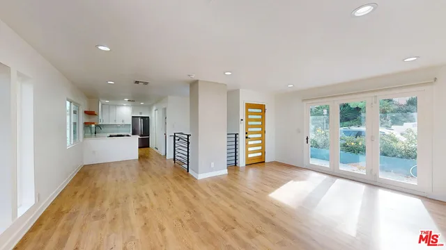 a view of a kitchen with wooden floor