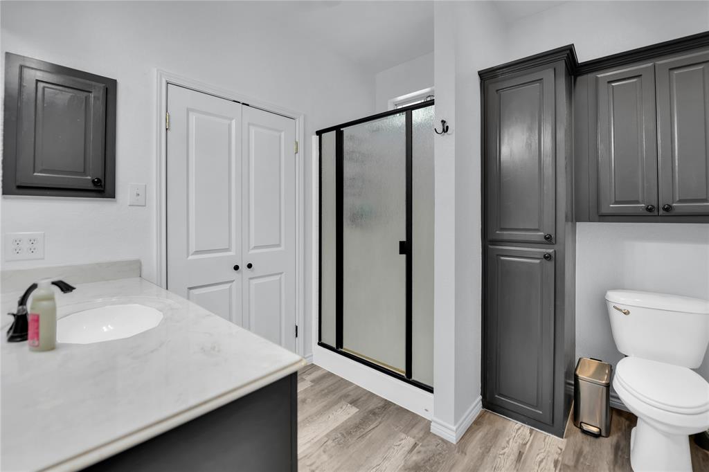 400 Deer Valley Road Weatherford, TX 76085 - Photo 16 of 40 a bathroom with a sink a toilet and shower