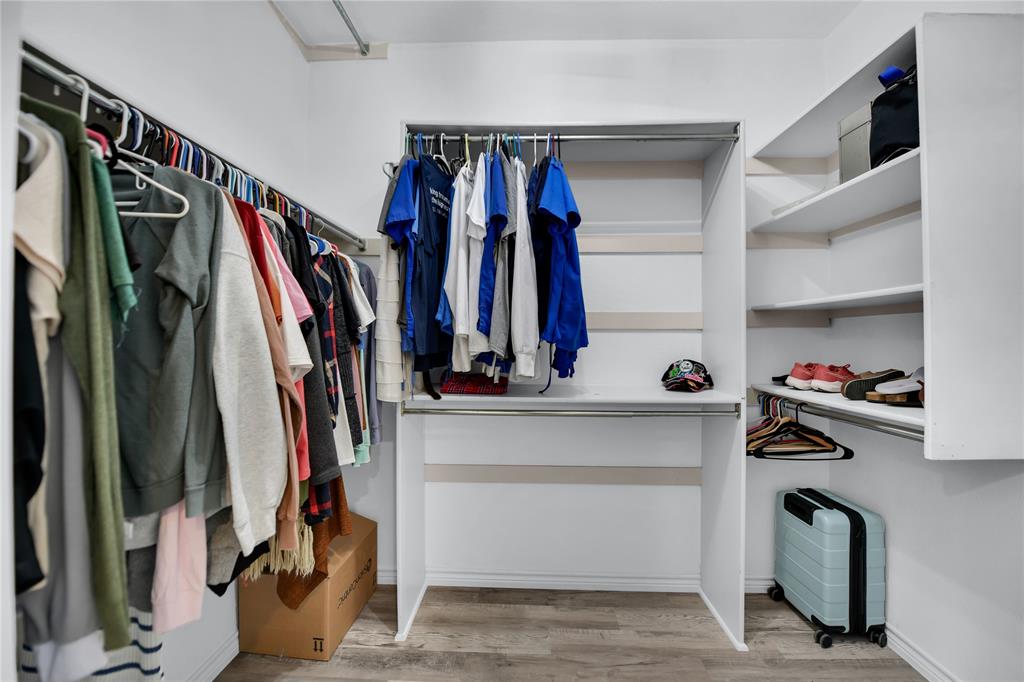 400 Deer Valley Road Weatherford, TX 76085 - Photo 17 of 40 a view of walk in closet with clothes and shoes