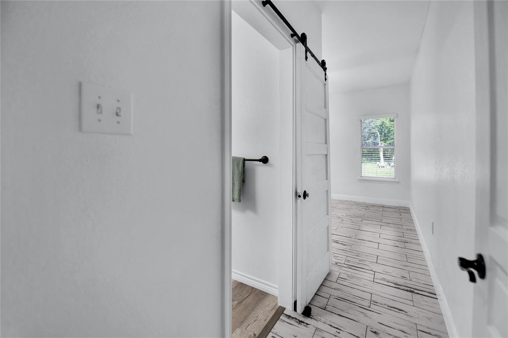 400 Deer Valley Road Weatherford, TX 76085 - Photo 18 of 40 a view of a hallway with wooden floor and closet