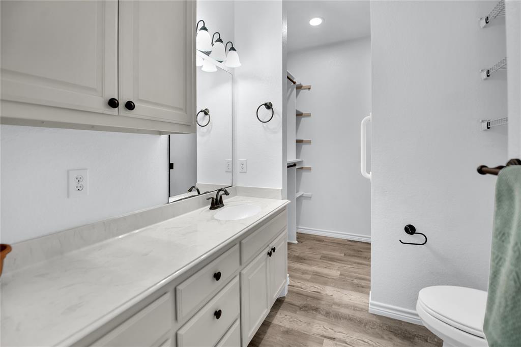 400 Deer Valley Road Weatherford, TX 76085 - Photo 20 of 40 a spacious bathroom with a sink a toilet and shower