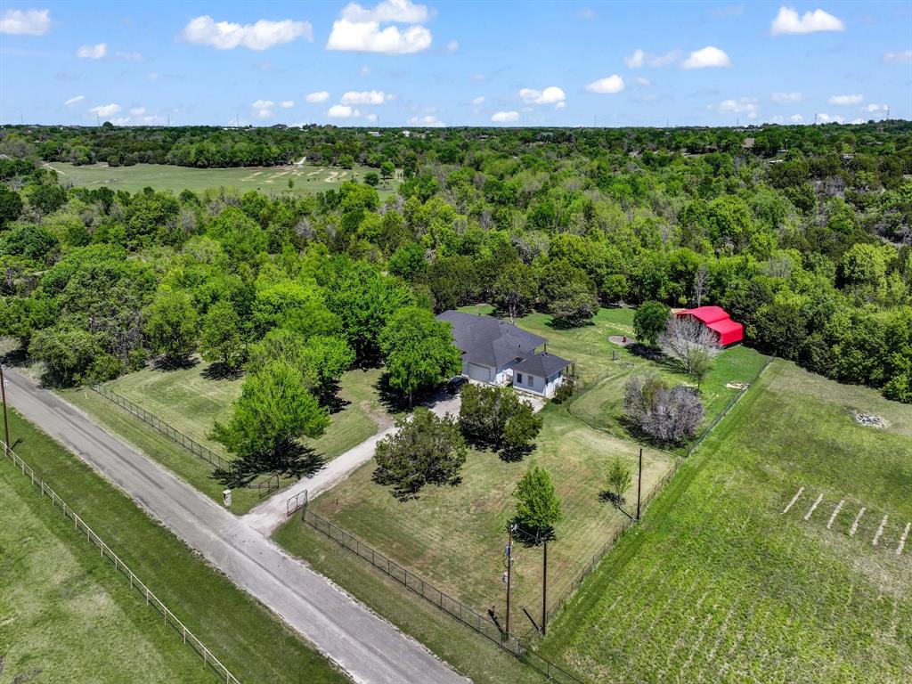 400 Deer Valley Road Weatherford, TX 76085 - Photo 2 of 40 a view of a backyard with plants and a garden