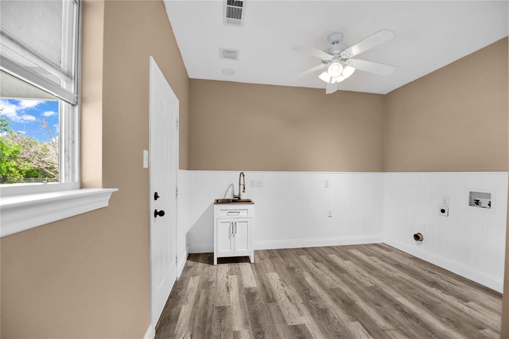 400 Deer Valley Road Weatherford, TX 76085 - Photo 26 of 40 a view of an empty room with wooden floor and a window