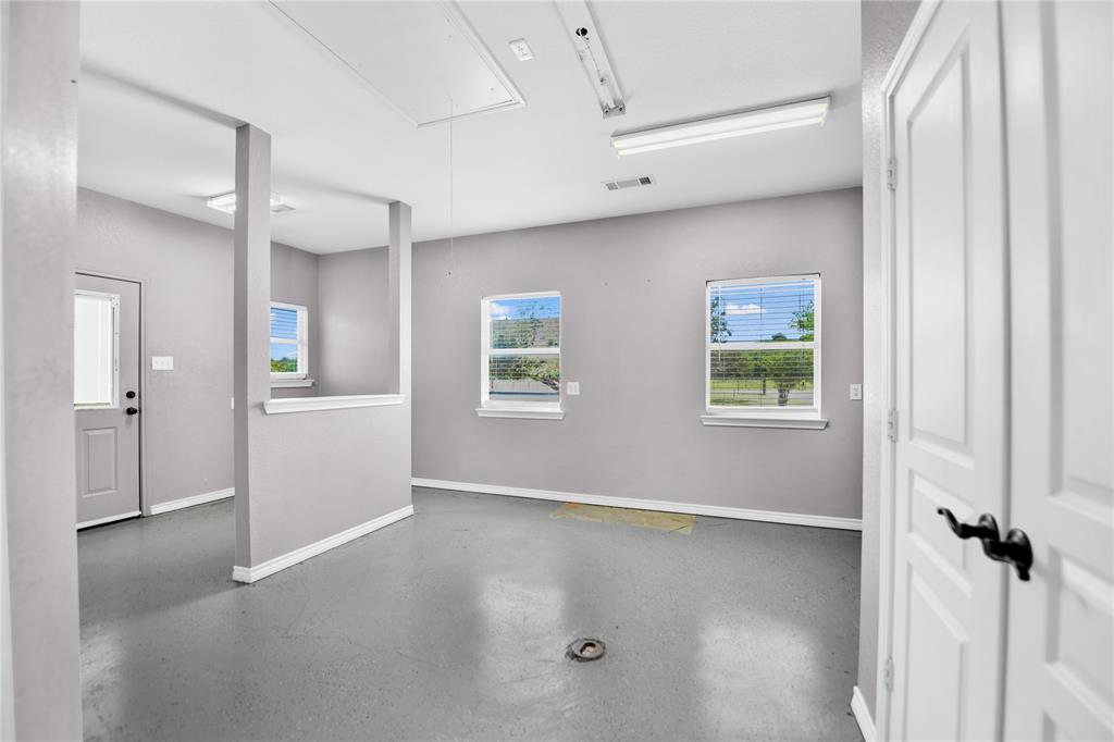 400 Deer Valley Road Weatherford, TX 76085 - Photo 28 of 40 wooden floor in an empty room with a window