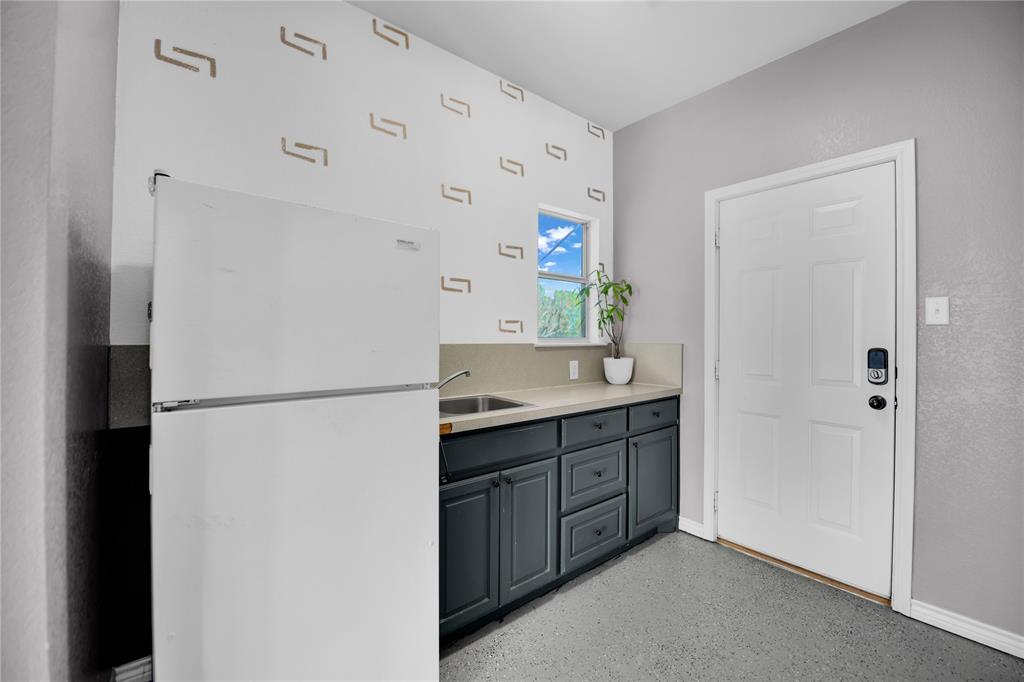 400 Deer Valley Road Weatherford, TX 76085 - Photo 29 of 40 a white refrigerator freezer sitting inside of a kitchen