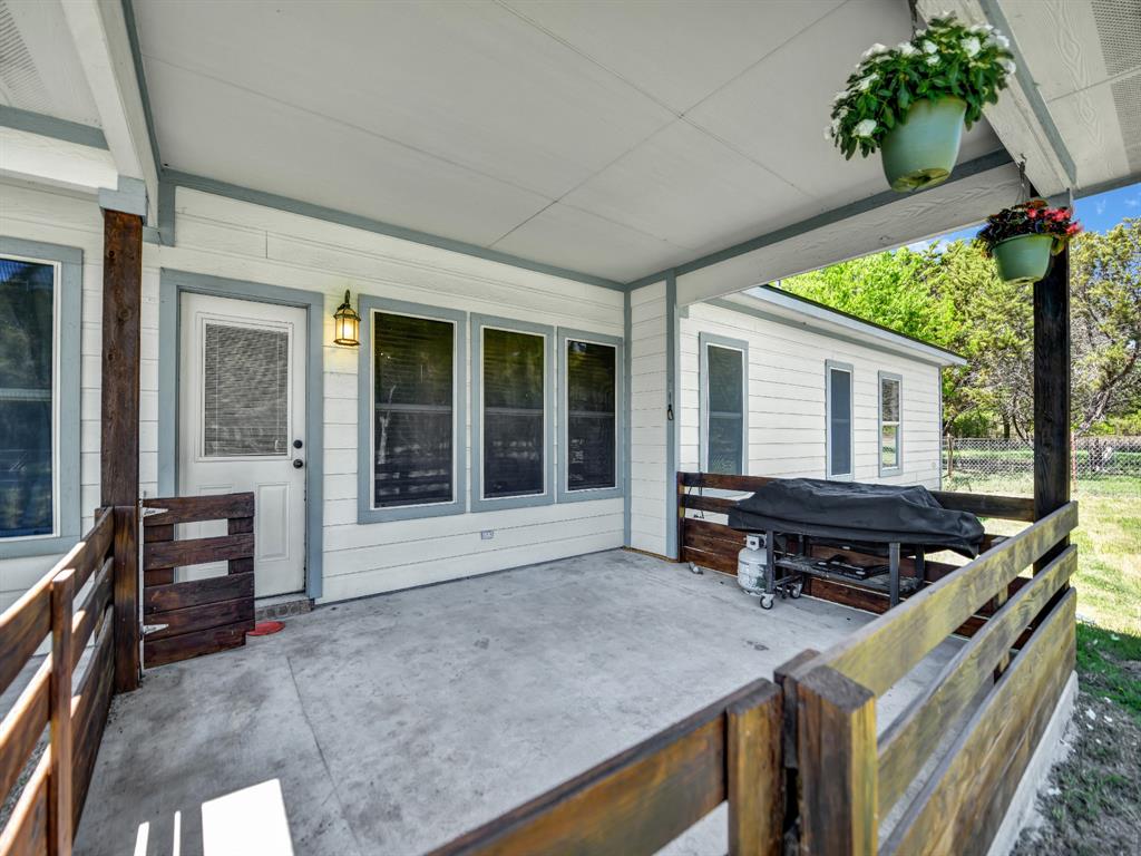 400 Deer Valley Road Weatherford, TX 76085 - Photo 33 of 40 a backyard of a house with dishwasher and outdoor seating