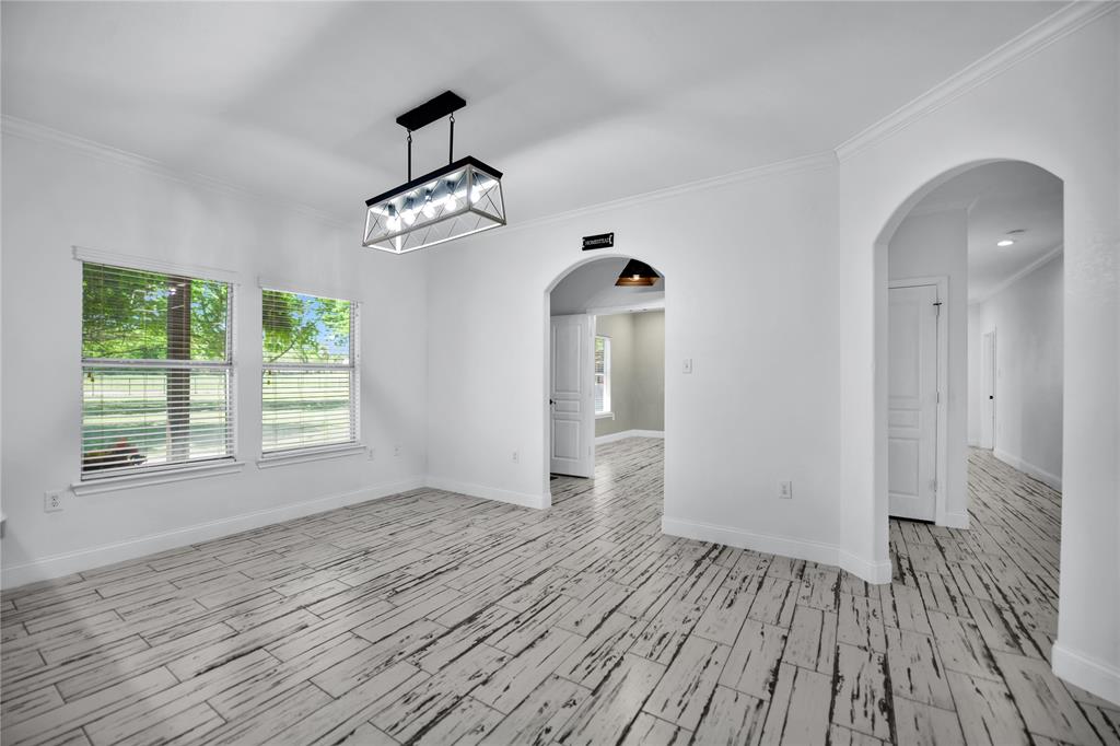 400 Deer Valley Road Weatherford, TX 76085 - Photo 9 of 40 wooden floor in an empty room with a window