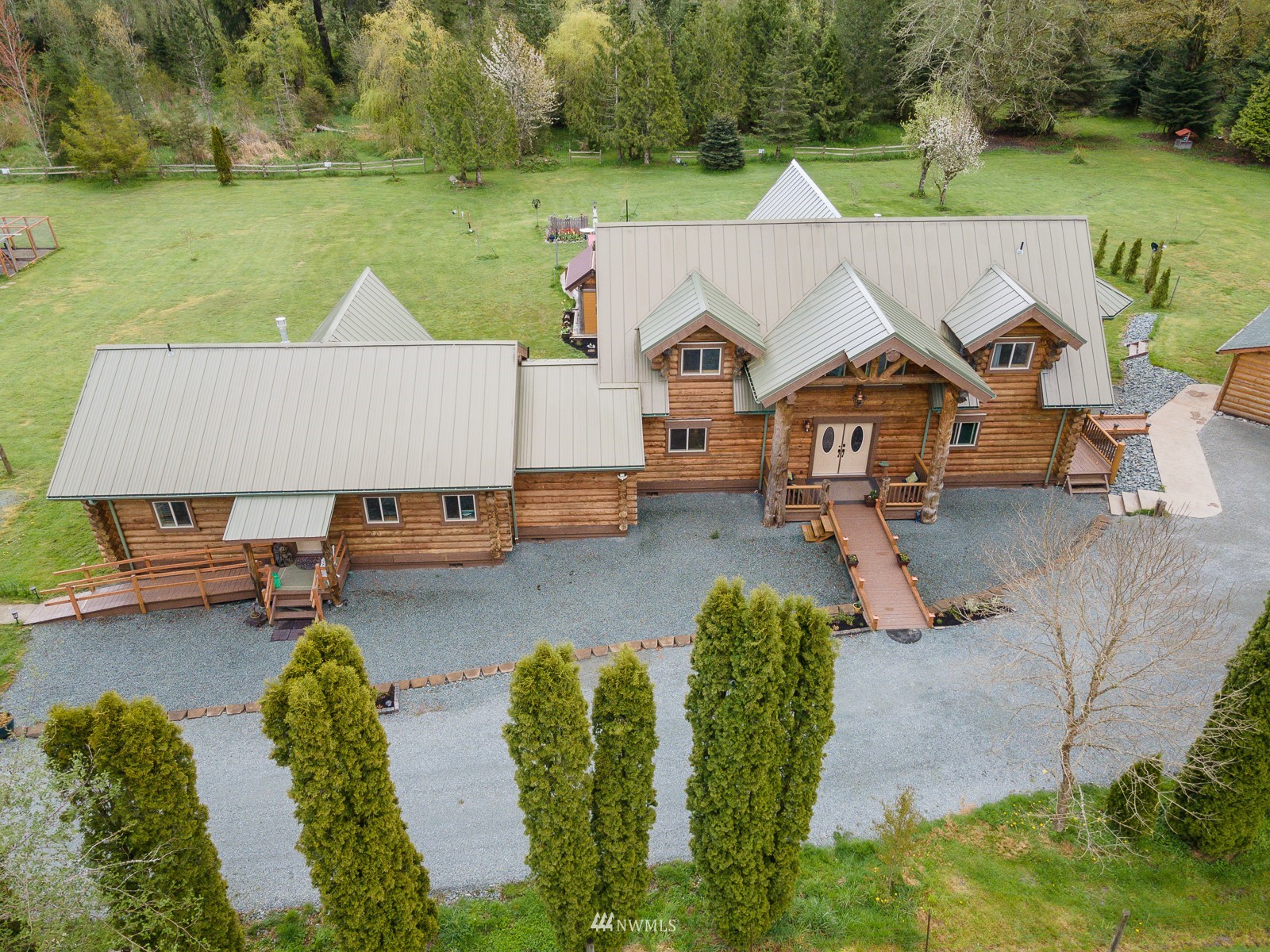 5255 Wickersham Road Acme, WA 98220 - Photo 2 of 40 an aerial view of a house with swimming pool and a yard