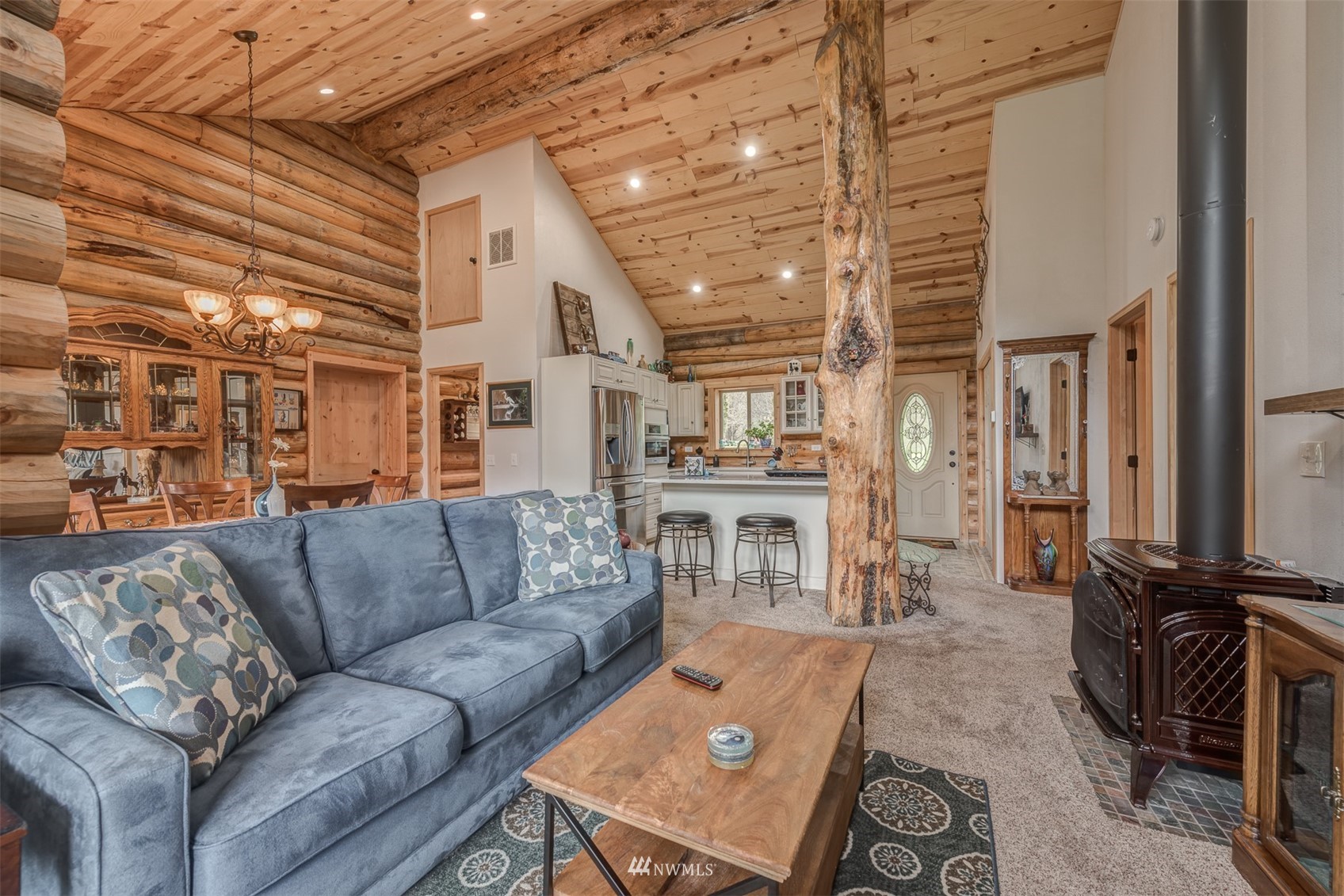 5255 Wickersham Road Acme, WA 98220 - Photo 23 of 40 a living room with furniture a flat screen tv and kitchen view