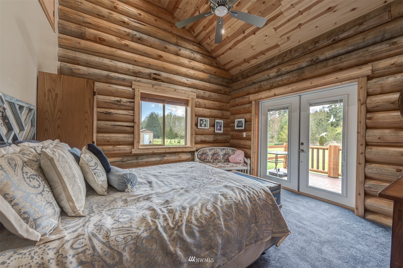 5255 Wickersham Road Acme, WA 98220 - Photo 24 of 40 a spacious bedroom with a large bed and a large window