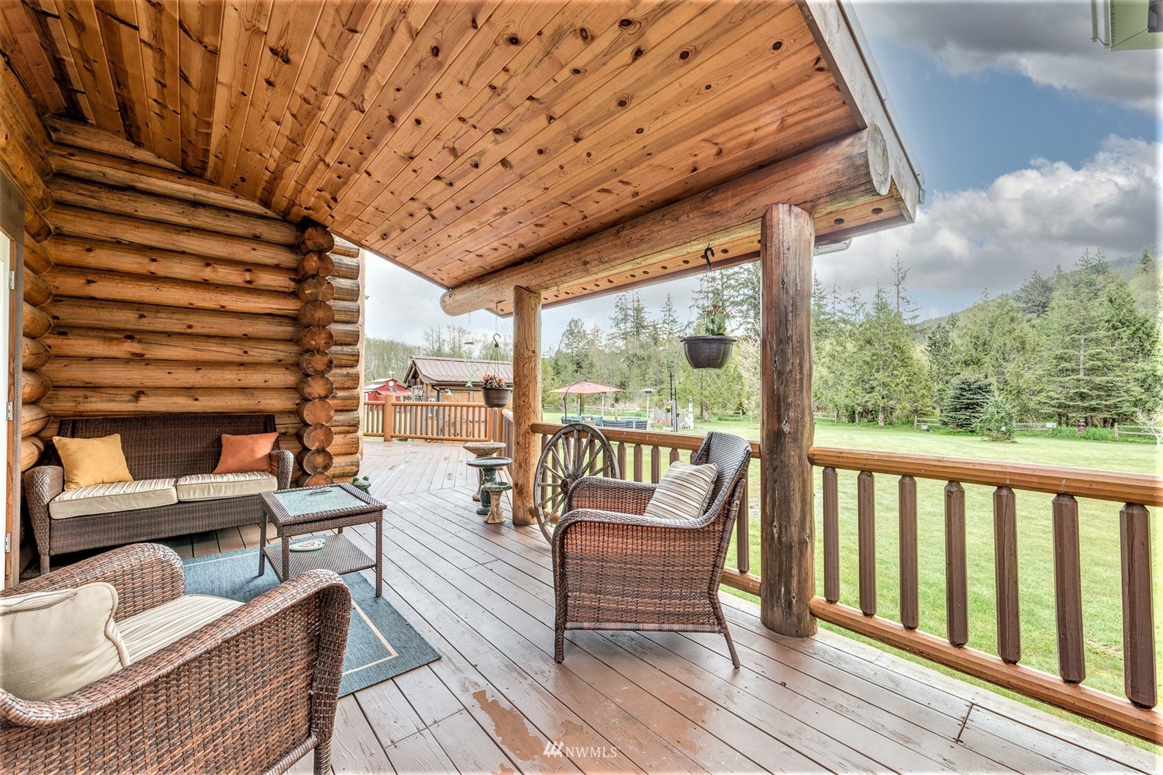 5255 Wickersham Road Acme, WA 98220 - Photo 30 of 40 a roof deck with couches and wooden floor
