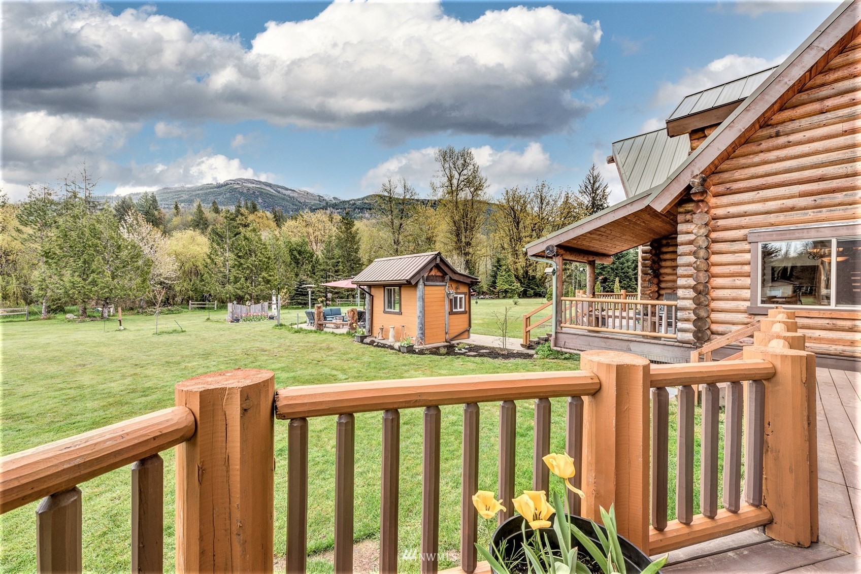 5255 Wickersham Road Acme, WA 98220 - Photo 32 of 40 a view of a house with a yard from a balcony