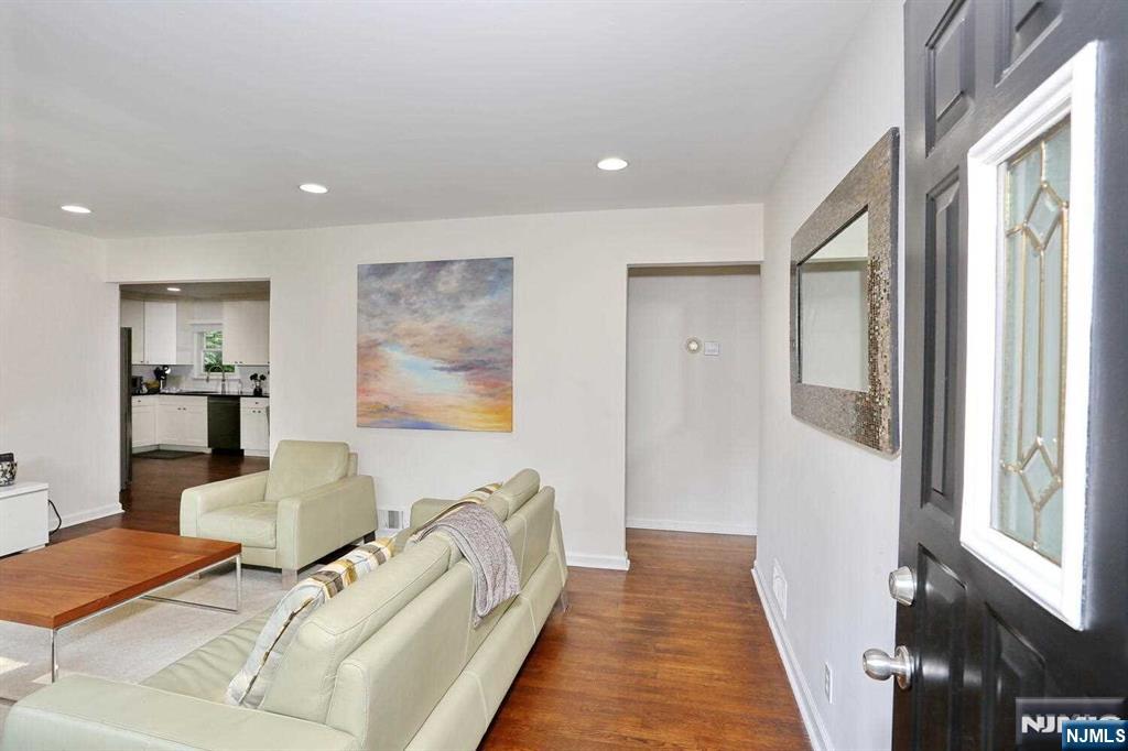 11 Evans Road Cresskill, NJ 07626 - Photo 6 of 31 a spacious bedroom with a bed and a couch