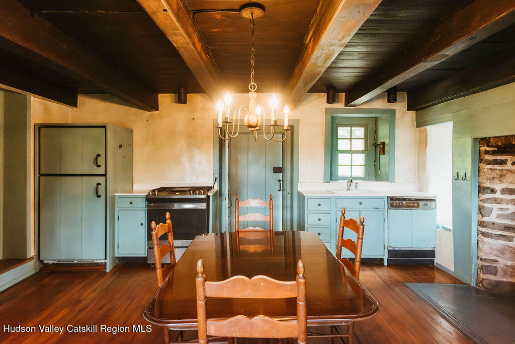 652 Albany Post Road New Paltz, NY 12561 - Photo 11 of 36 a dining room with furniture and wooden floor