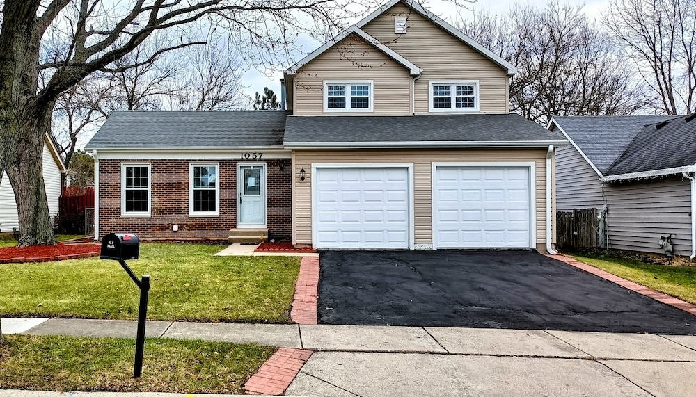 1057 Bothwell Circle Bolingbrook, IL 60440 - Photo 1 of 14 a view of a yard in front view of a house