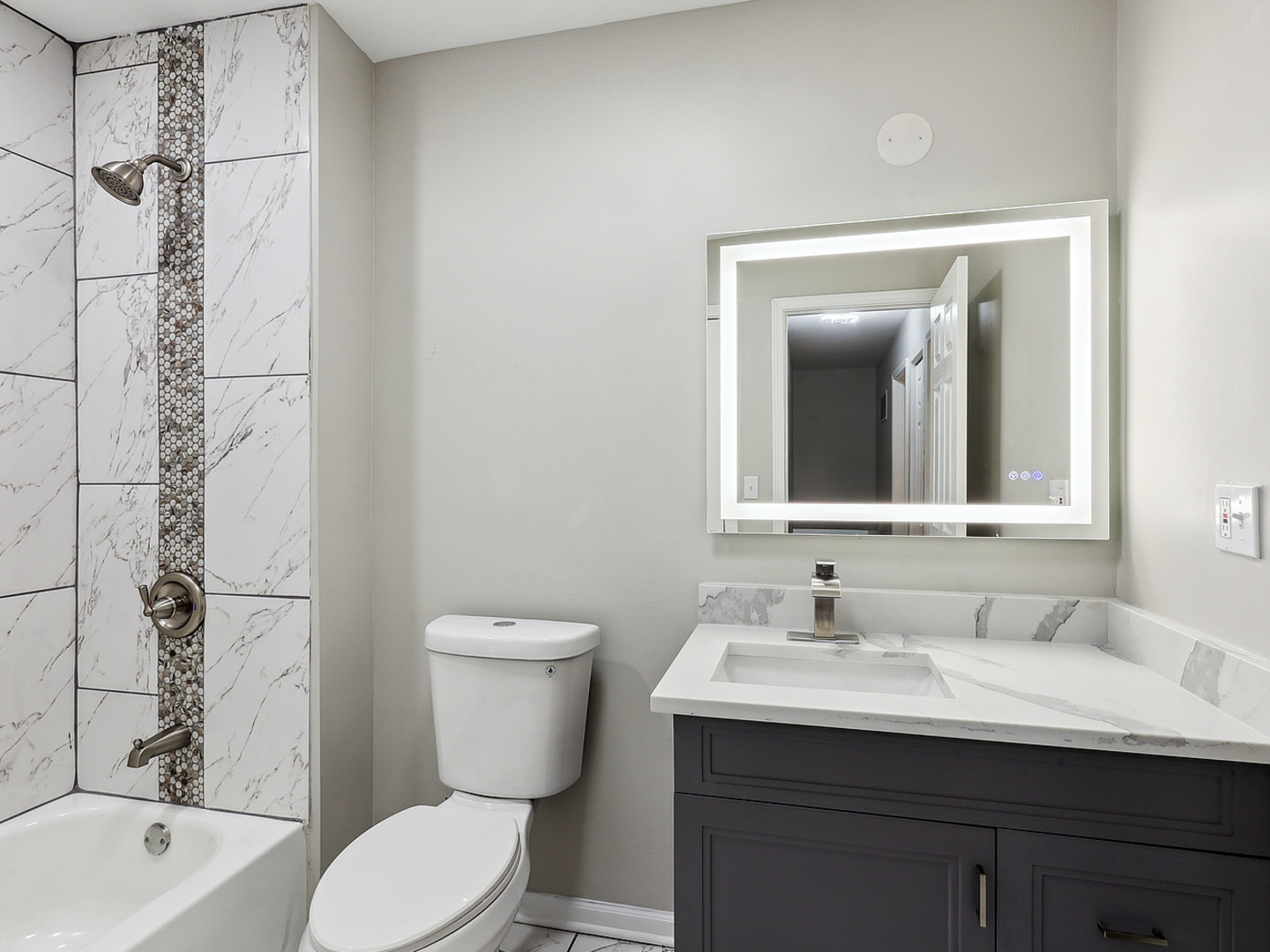 1057 Bothwell Circle Bolingbrook, IL 60440 - Photo 11 of 14 a bathroom with a granite countertop sink toilet and shower