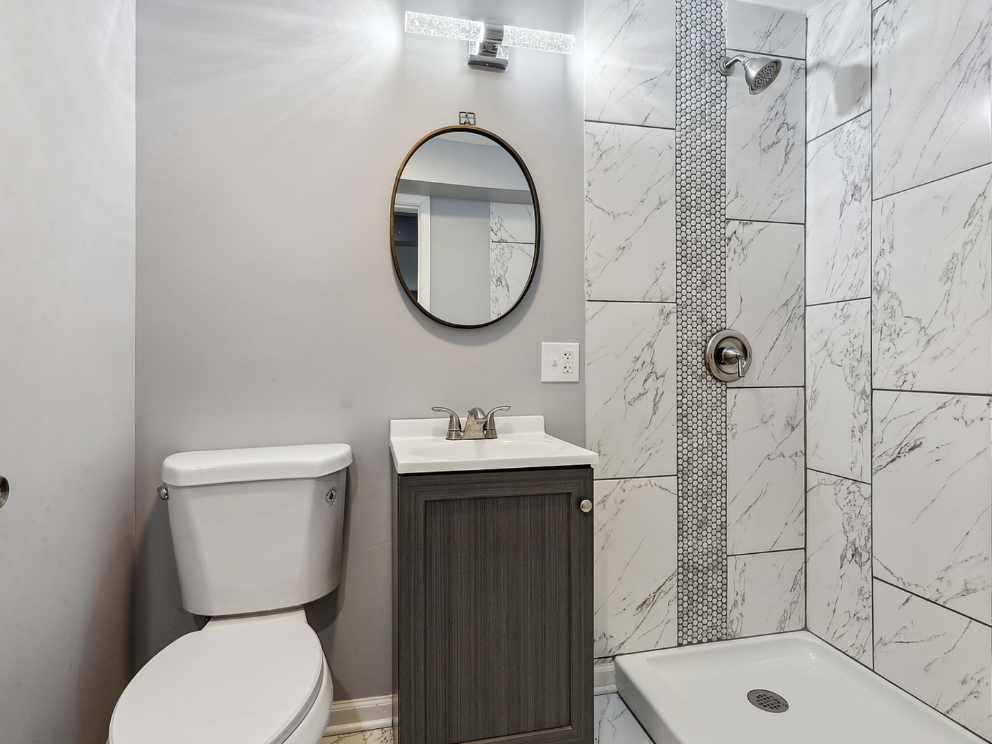 1057 Bothwell Circle Bolingbrook, IL 60440 - Photo 12 of 14 a bathroom with a sink toilet and shower