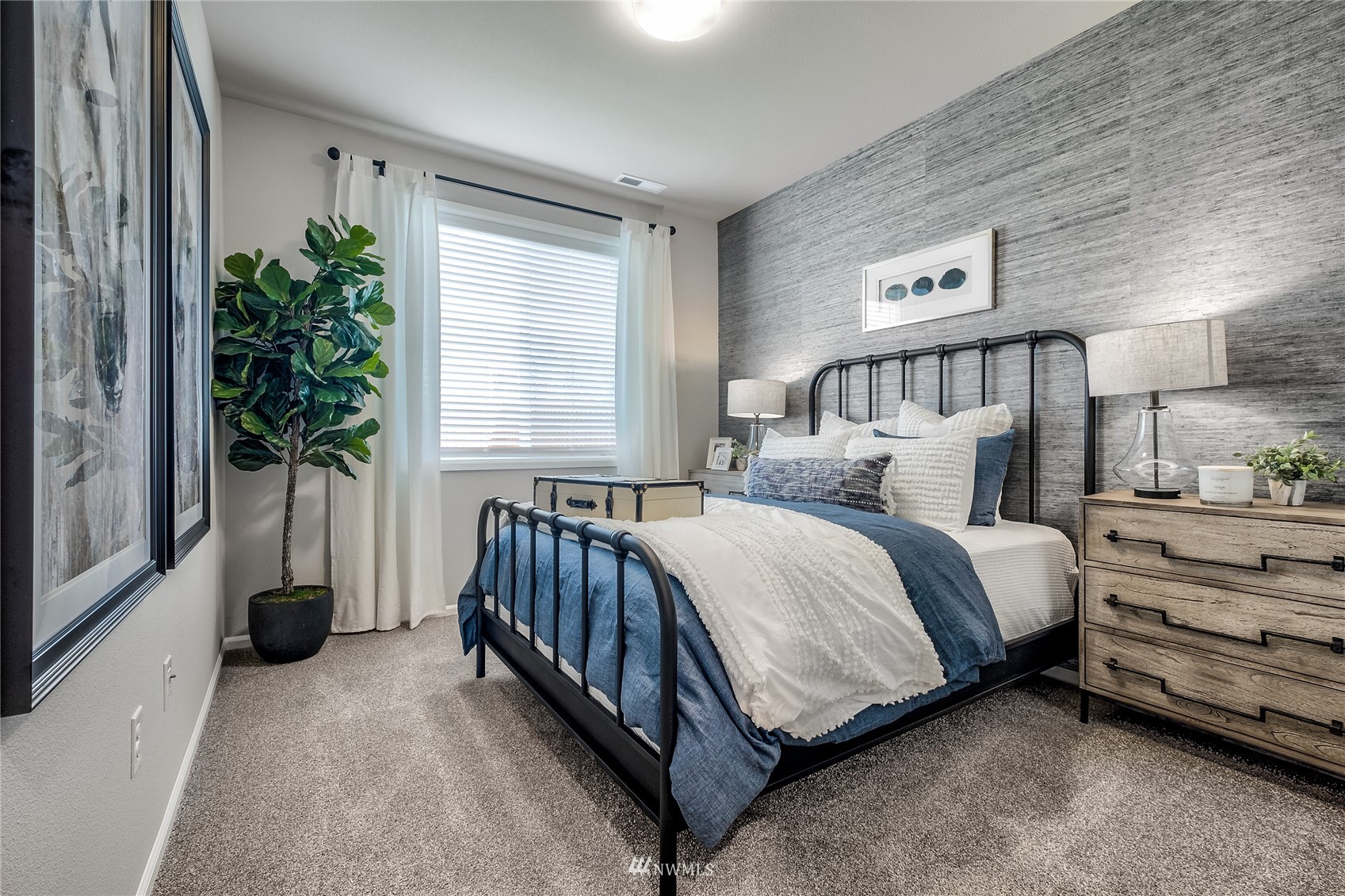 23318 41st Drive Southeast, Unit 68 Bothell, WA 98021 - Photo 13 of 24 a bed sitting in a bedroom next to a window