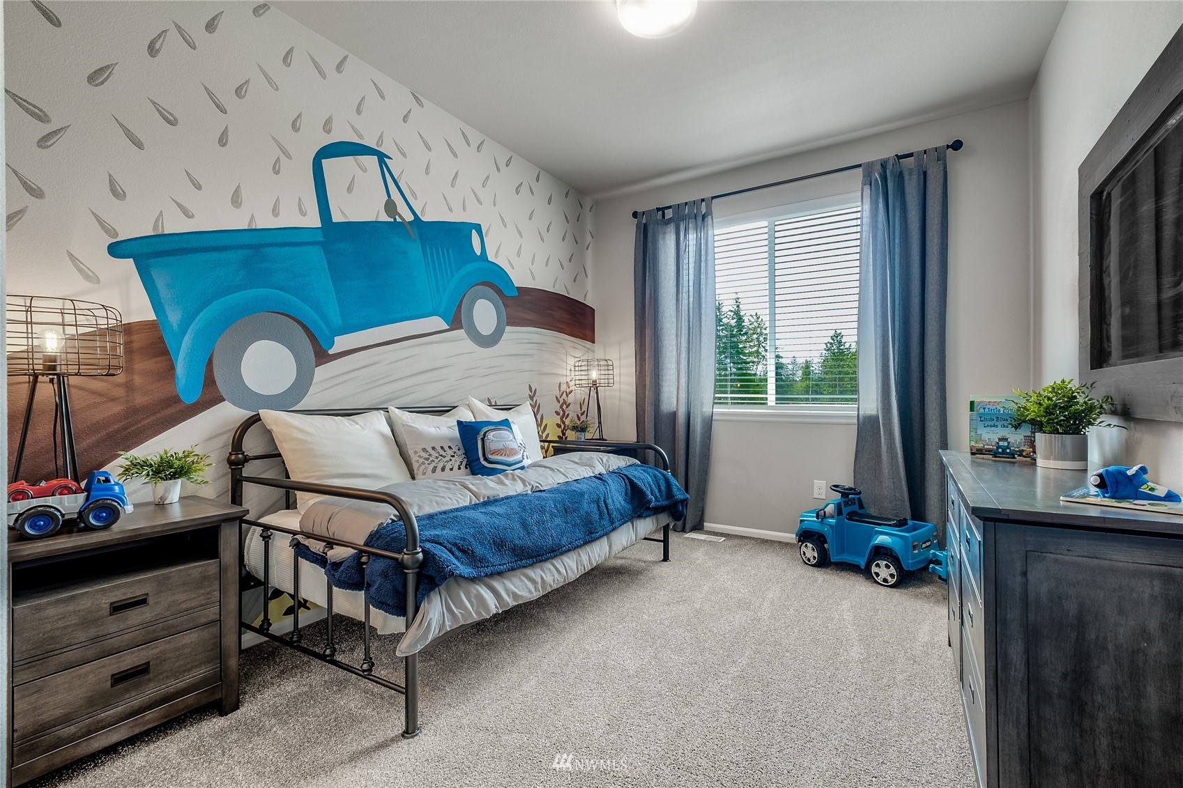 23318 41st Drive Southeast, Unit 68 Bothell, WA 98021 - Photo 16 of 24 a bedroom with a bed and a potted plant
