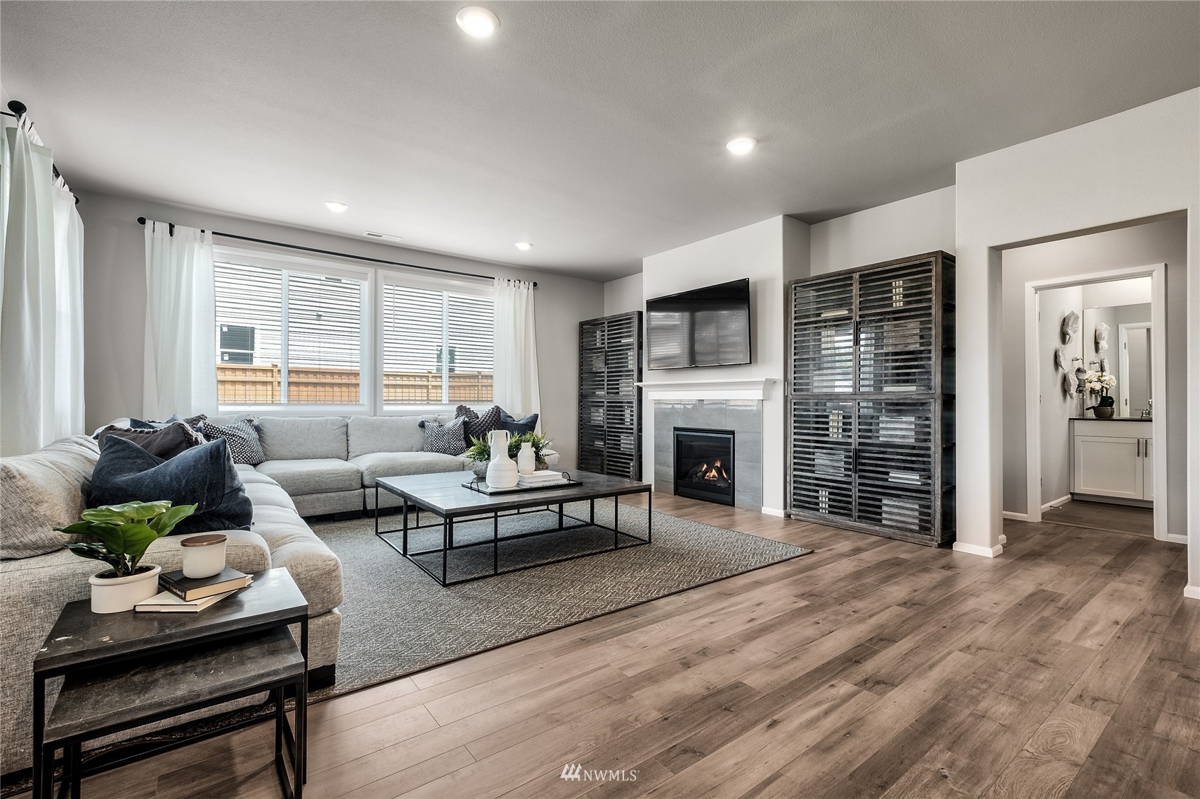 23318 41st Drive Southeast, Unit 68 Bothell, WA 98021 - Photo 8 of 24 a living room with furniture and a fireplace