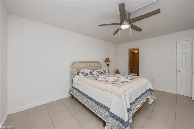 a bathroom with a sink shower and a mirror