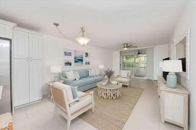 a spacious bathroom with a granite countertop sink a mirror and a shower