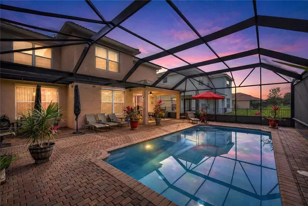 a view of a swimming pool with a patio