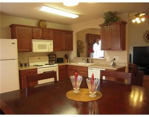 a kitchen with a refrigerator and a sink