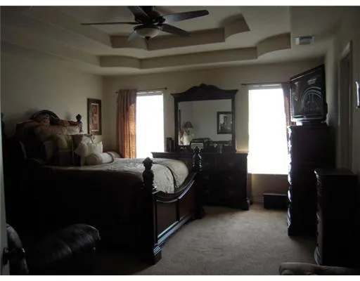 a bed room with furniture and a window