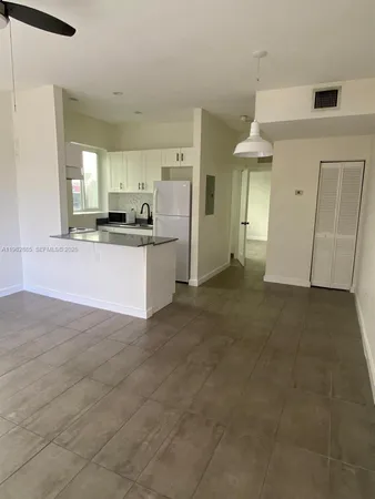a view of a kitchen with a sink