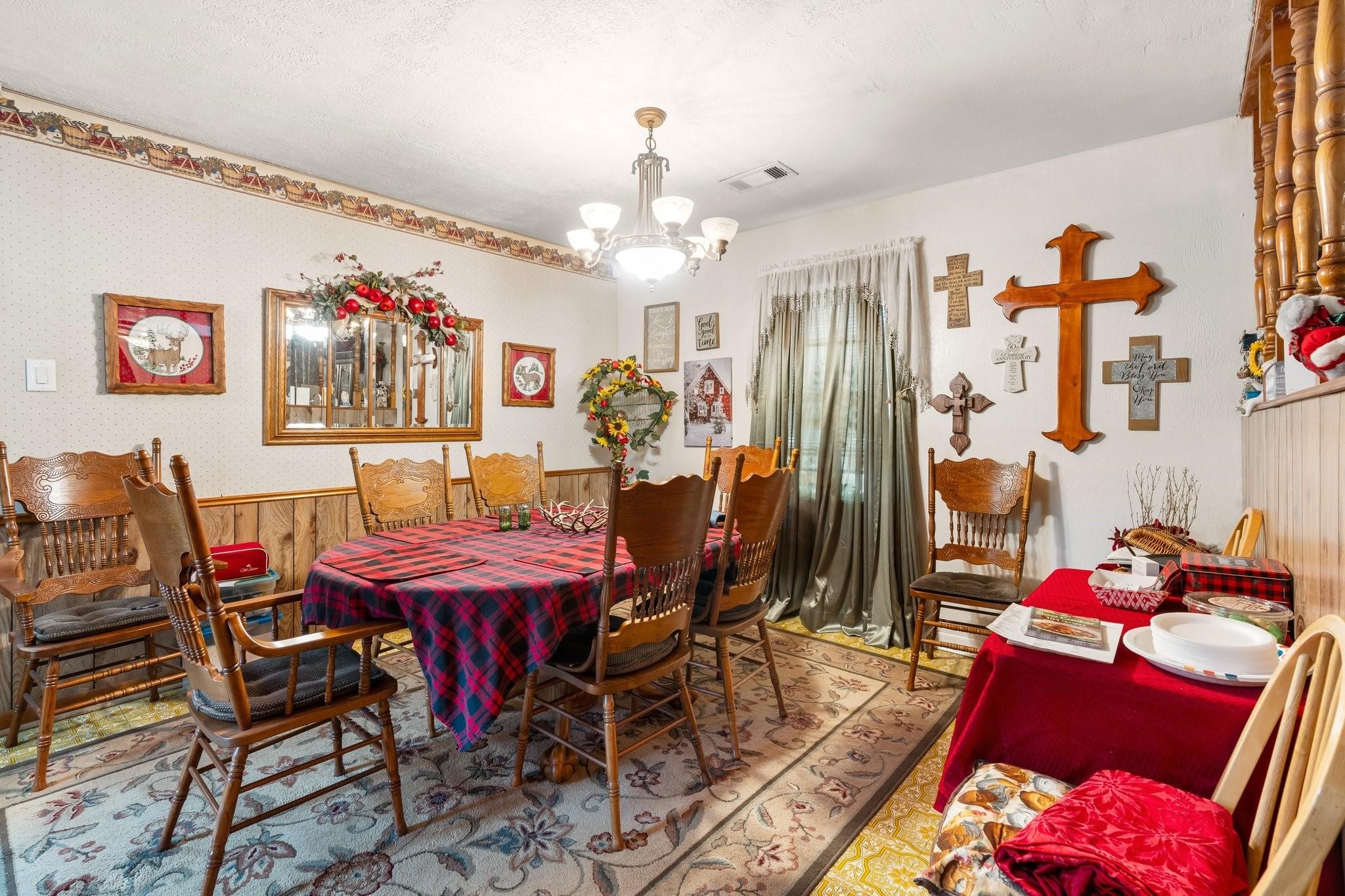 15091 Farm To Market 1485 Conroe, TX 77306 - Photo 9 of 28 a view of a dining room with furniture and chandelier
