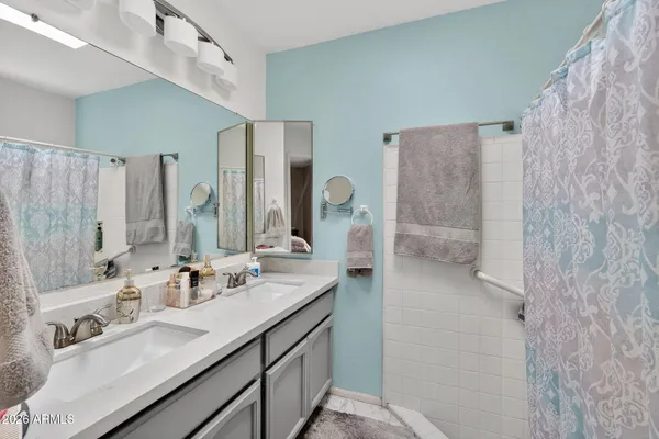 a bed room with a bed and a flat screen tv