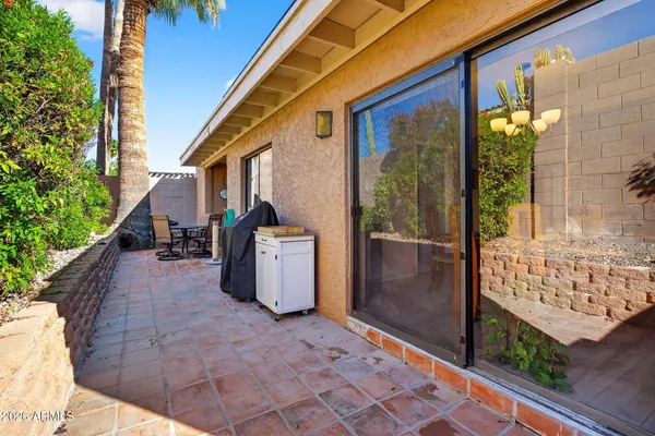 a bathroom with a sink a toilet and shower curtain