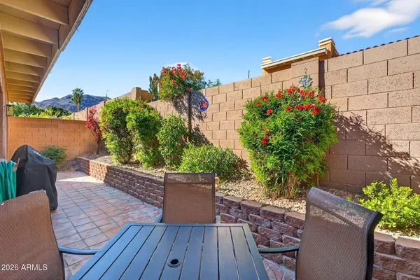 a view of a porch with wooden floor and roof
