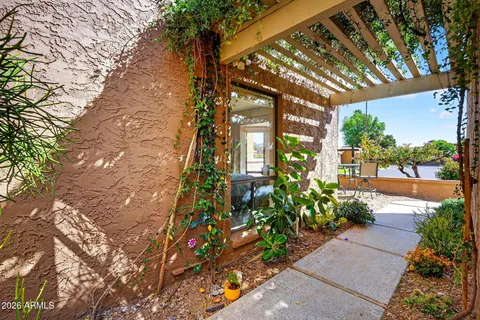 front view of a house with potted plants