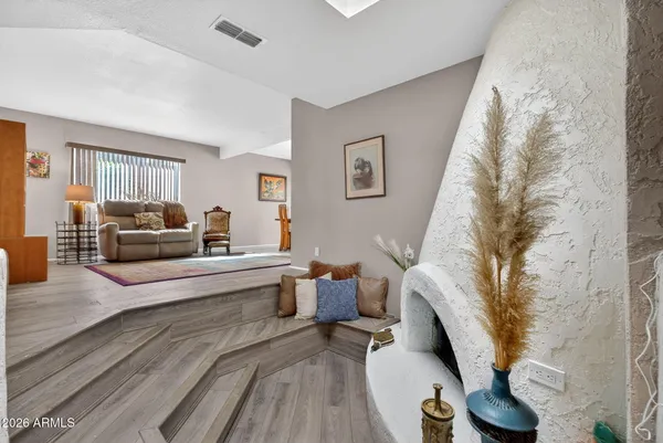 a living room with furniture and a large window