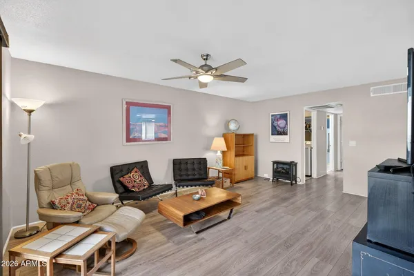a living room with furniture and a fireplace