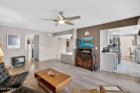 a living room with furniture fireplace and flat screen tv