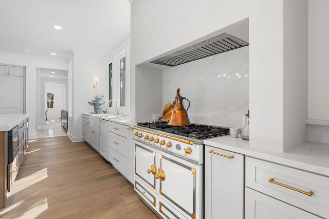 a outdoor space with patio the couches and a dining table with the kitchen view
