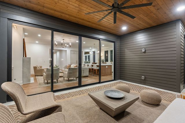 a spacious bathroom with a granite countertop sink toilet and mirror
