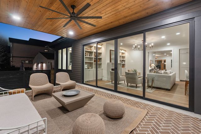 a bathroom with a granite countertop toilet sink and mirror